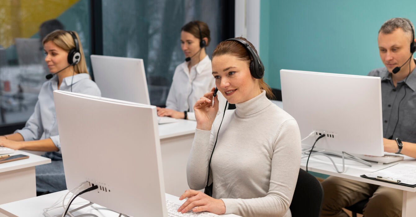 colleagues-with-headphones-working-call-center-office